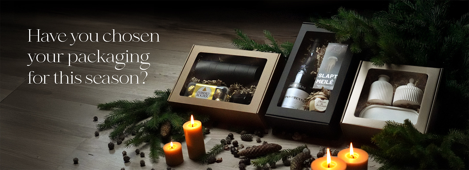 Three elegantly packaged gift boxes with candles and pine decorations, accompanied by the text: "Have you chosen your packaging for this season?