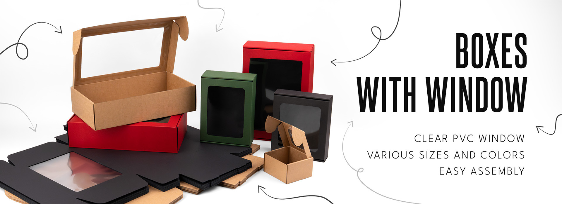 A variety of cardboard boxes with transparent PVC windows in different sizes and colors, displayed on a white background.